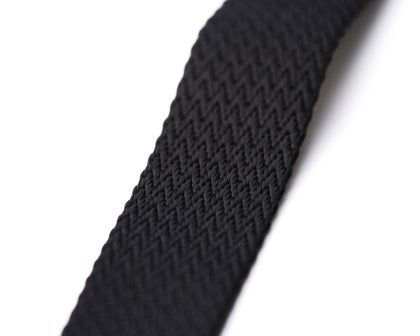Close-up of the textured pattern on a black Apex NATO strap, highlighting the intricate weaving and premium quality on a pristine white background - Experience the top-tier with Under the Cuff's Apex NATO Range.
