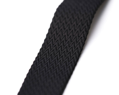 Close-up of the textured pattern on a black Apex NATO strap, highlighting the intricate weaving and premium quality on a pristine white background - Experience the top-tier with Under the Cuff's Apex NATO Range.